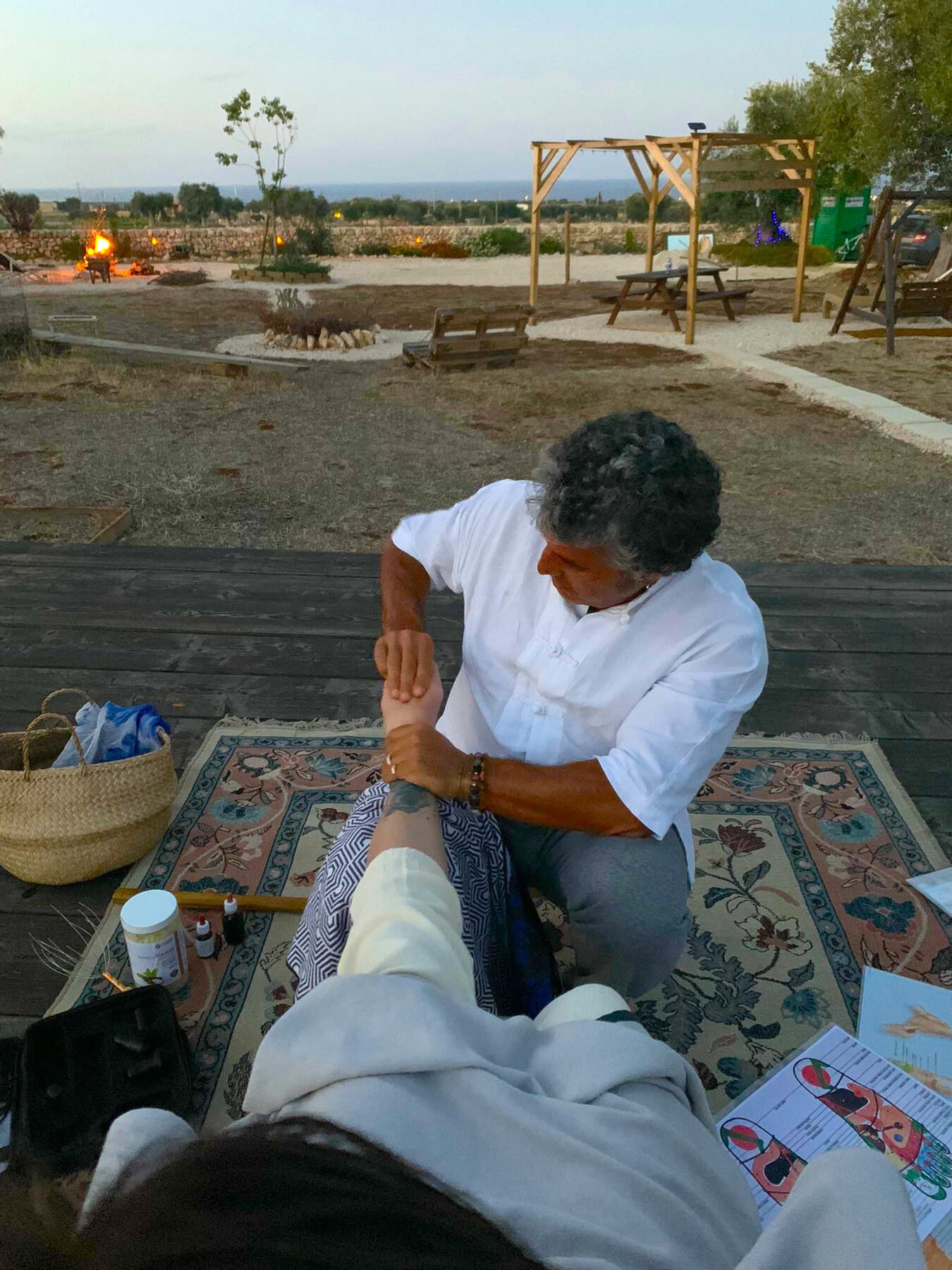 Foot reflexology on the wooden deck at Bibiland